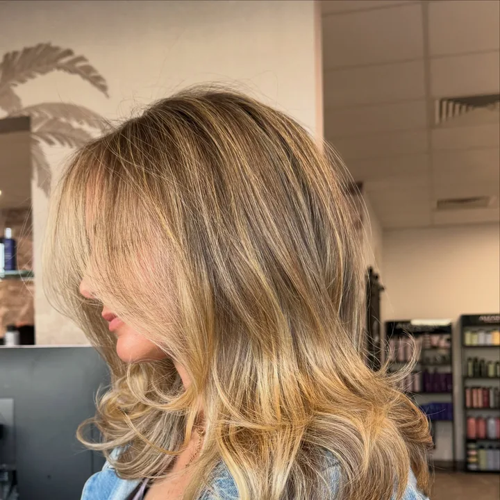 Dimensional blonde layers photographed inside the salon
